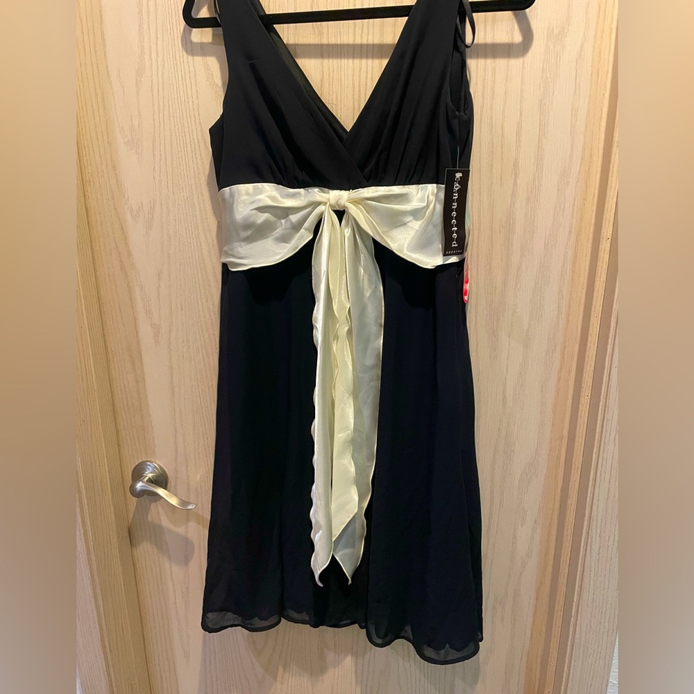 Size 10, black with cream bow dress.  Never worn